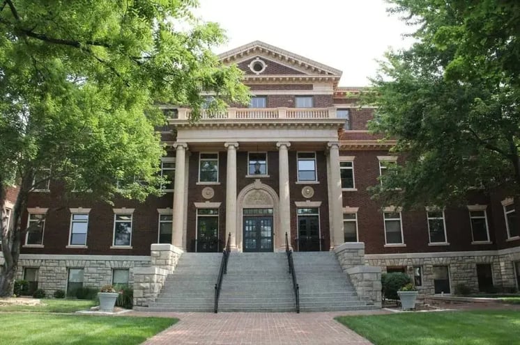 Front street view of the Kansas City University College of Osteopathic Medicine building with stairs leading up the the main front entrance
