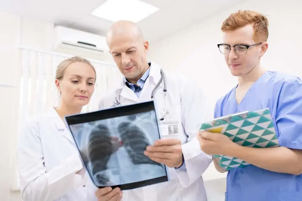 Med student and Doctor Looking at an X-ray