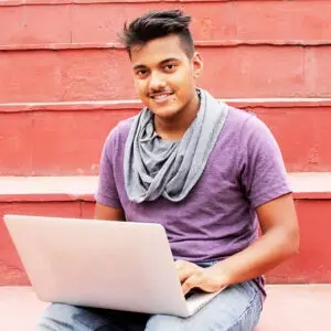 A pre-med student going through the medical school application process on a laptop.